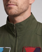 Men's olive green flight suit Halloween costume with zip front and embroidered patches - view 2