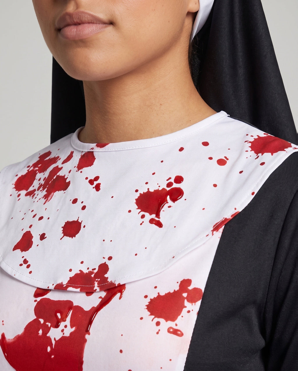 Women's bloody nun Halloween costume, black long sleeve dress with white blood-splatter panel, tie belt and veil - view 2