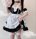 Women's ruffled maid Halloween costume with white tiered apron and lace-trimmed sweetheart bodice