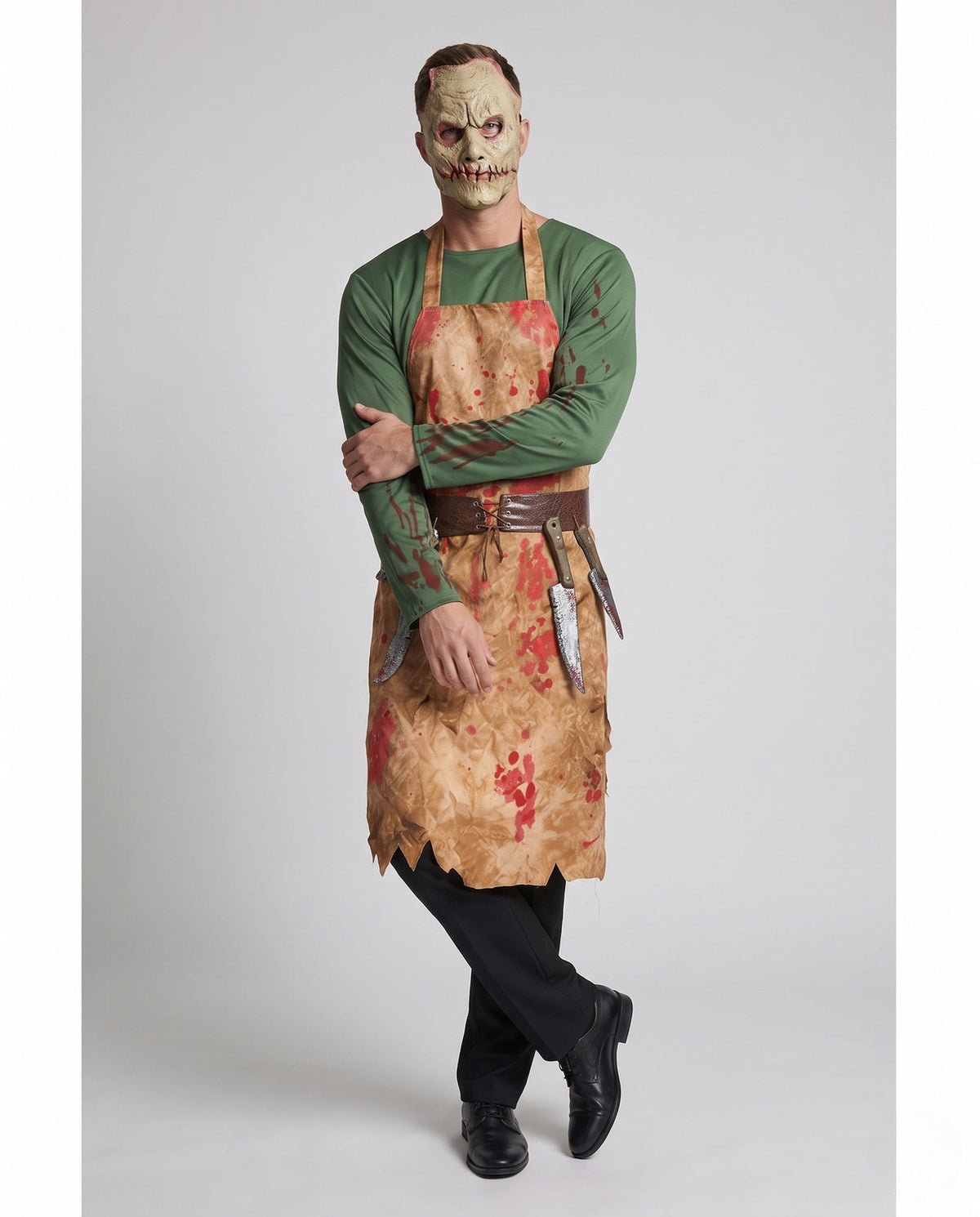Men's butcher Halloween costume with blood-splatter print apron, green top and stitched-face mask