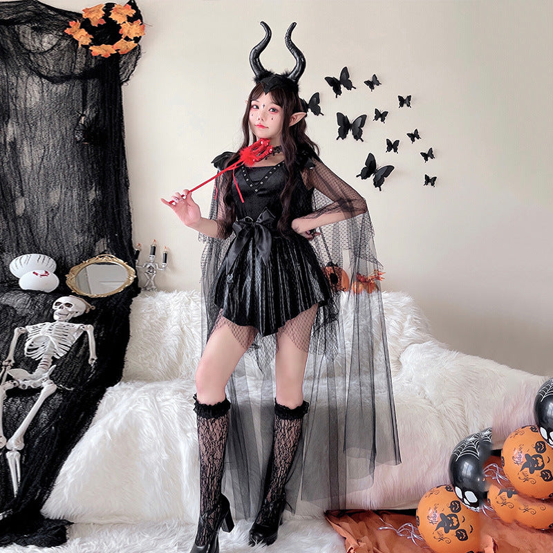Women's black velvet Halloween costume dress with satin bow and sheer dotted tulle cape