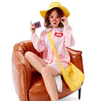Woman in light pink smock dress Halloween costume with white Peter Pan collar and yellow bucket hat - view 2