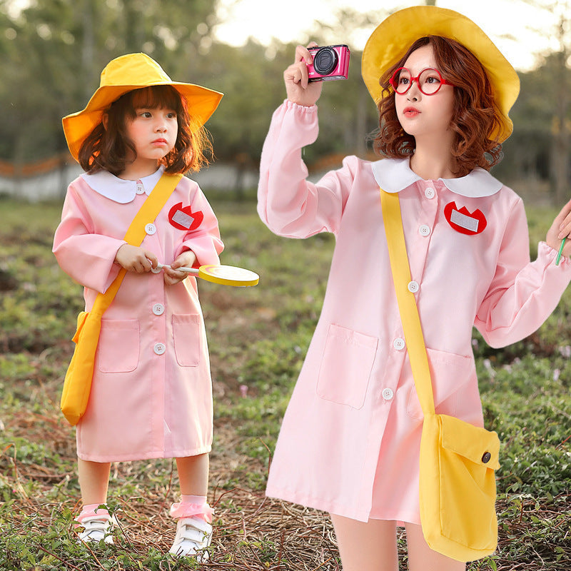 Woman in light pink smock dress Halloween costume with white Peter Pan collar and yellow bucket hat - view 3
