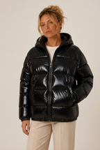 Hooded glossy puffer winter jacket for women with elastic cuffs