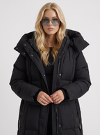 Model in a quilted hooded winter puffer jacket with self-tie belt - view 2