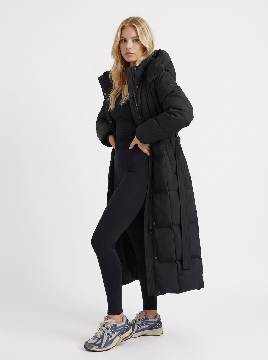 Model in a quilted hooded winter puffer jacket with self-tie belt - view 3