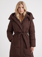 Model in a quilted hooded winter puffer jacket with self-tie belt - view 8