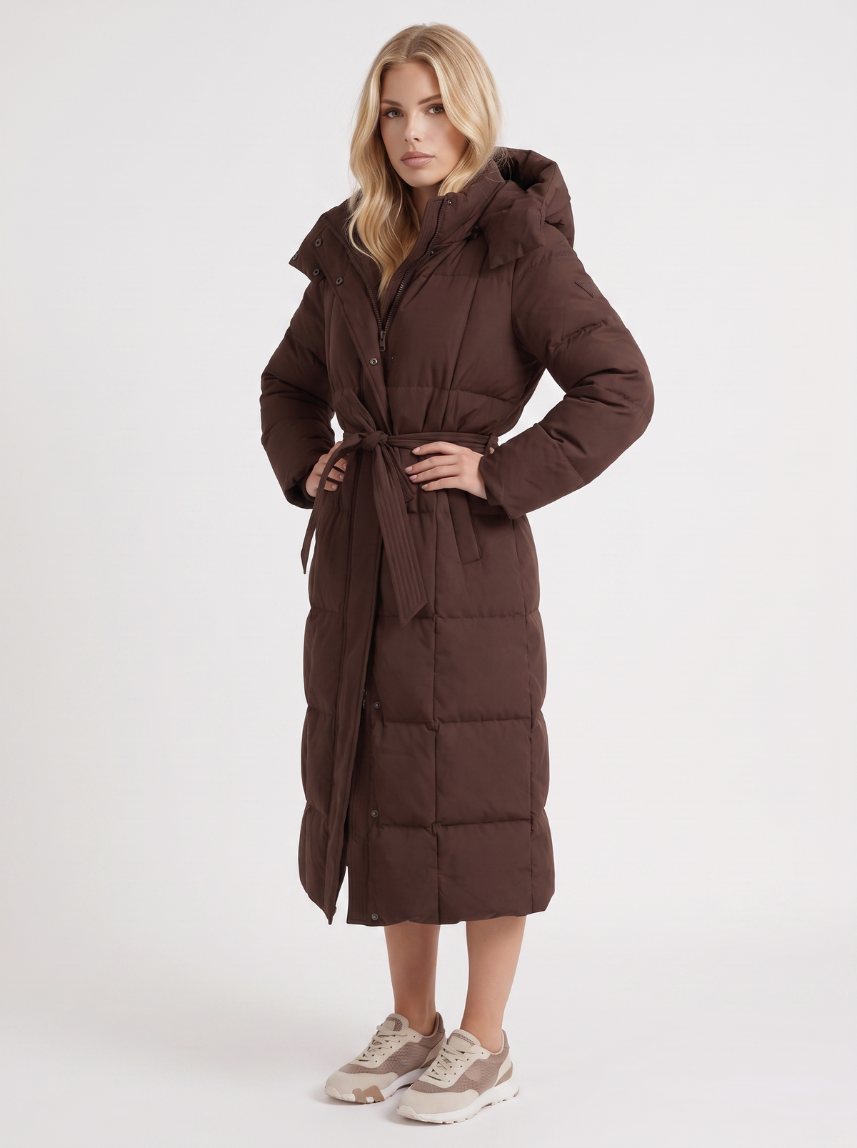 Model in a quilted hooded winter puffer jacket with self-tie belt - view 9