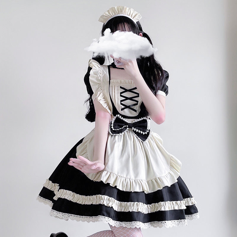 Women's maid Halloween costume with ivory ruffled apron, lace-up bib and bow - view 3