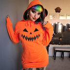 Orange hoodie dress with black jack-o'-lantern face print