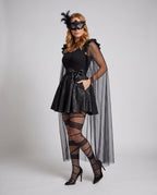 Women's black Halloween costume dress with sheer tulle cape, ruffled shoulders and satin bow sash