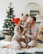 Matching family Christmas pajamas with red and green reindeer and snowflake print and gray ribbed cuffs - view 4