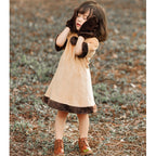 Girl wearing a deer Halloween costume with antler hood cape, faux fur trimmed dress and mittens - view 3
