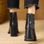 Black leather ankle boots with block heel, pointed toe and back zip, worn with cropped jeans - view 5
