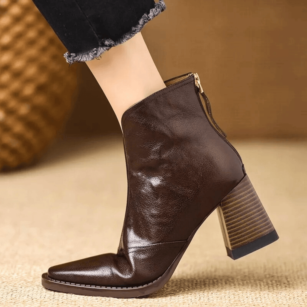 Black leather ankle boots with block heel, pointed toe and back zip, worn with cropped jeans - view 7