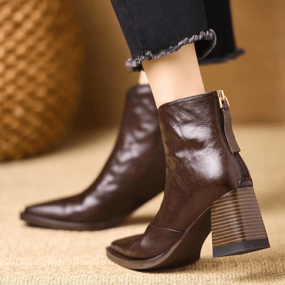 Black leather ankle boots with block heel, pointed toe and back zip, worn with cropped jeans - view 8