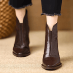 Black leather ankle boots with block heel, pointed toe and back zip, worn with cropped jeans - view 9