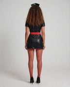 Woman wearing black leather-look nurse costume mini dress with red piping, red belt and nurse hat - view 3