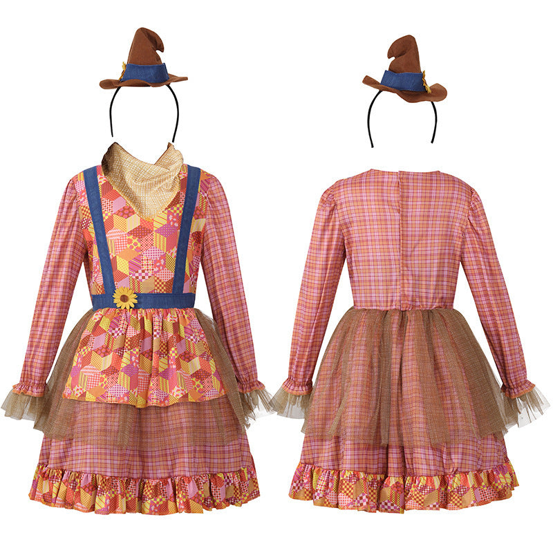 Girl wearing a pink plaid scarecrow Halloween costume dress with patchwork apron, sunflower and mini hat - view 6