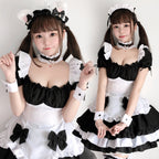 Black and white ruffled maid Halloween costume dress with puff sleeves, bow apron and tiered skirt - view 2