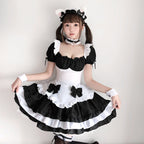 Black and white ruffled maid Halloween costume dress with puff sleeves, bow apron and tiered skirt - view 3