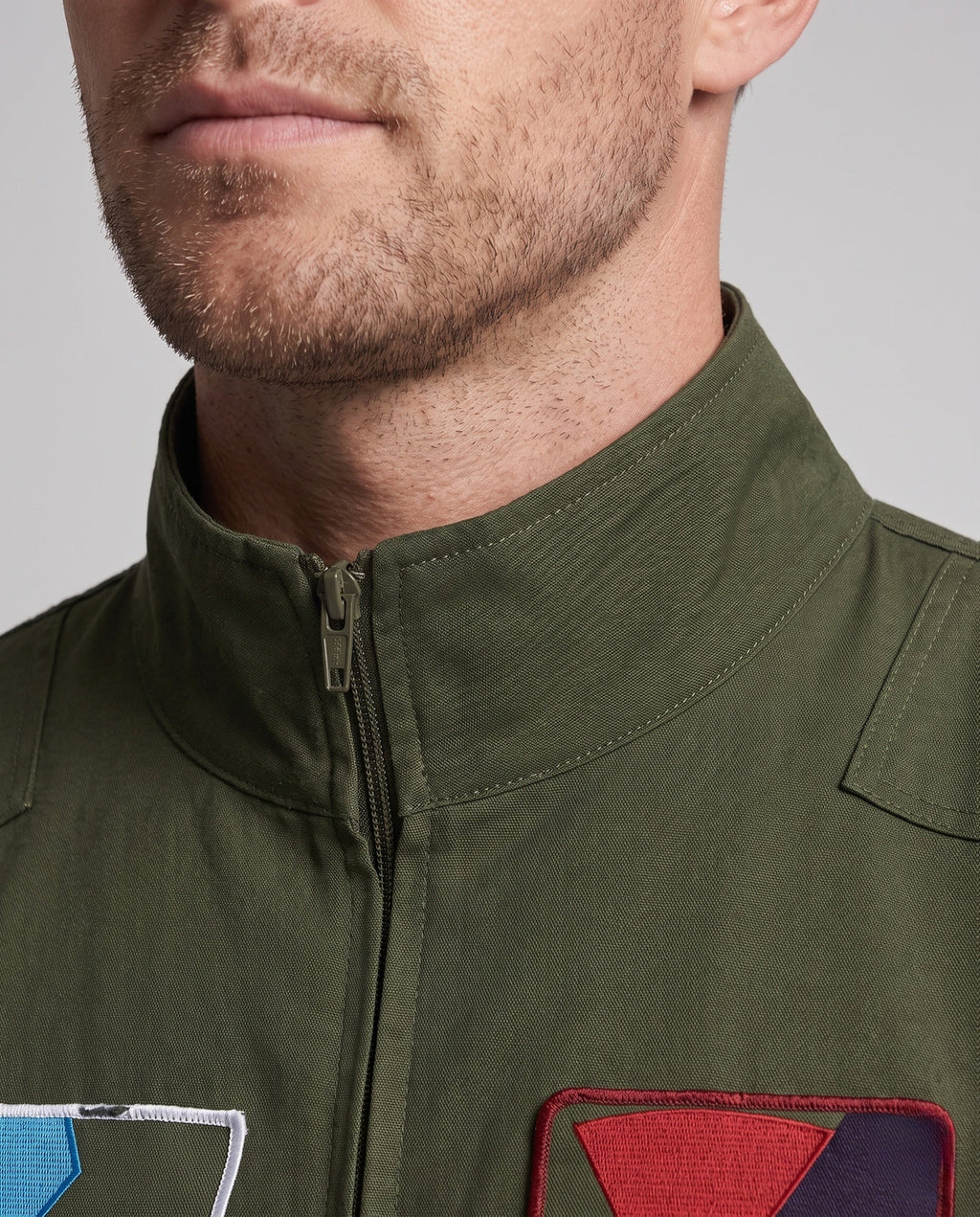 Men's olive green flight suit Halloween costume with embroidered patches and front zip - view 2