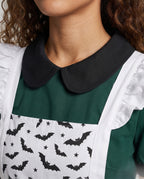 Woman wearing green Halloween costume dress with white bat-print ruffled apron - view 2