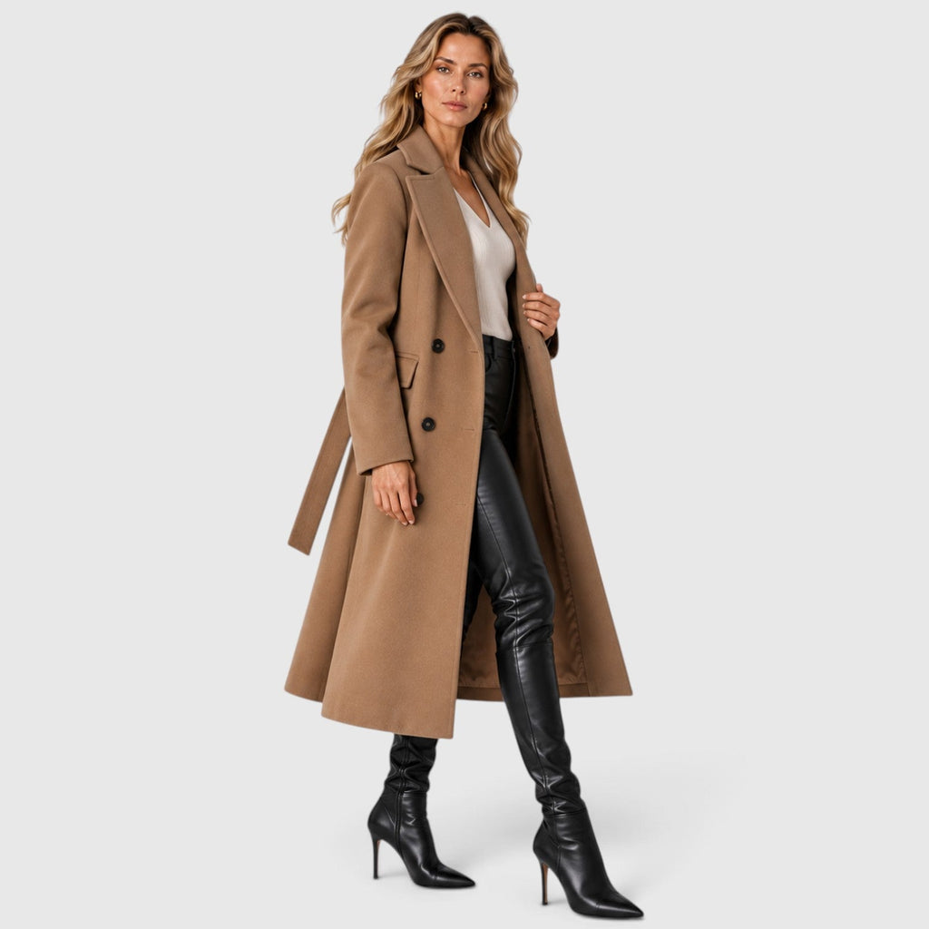 Woman wearing a long double breasted belted coat with wide lapels and knee-high boots - view 11