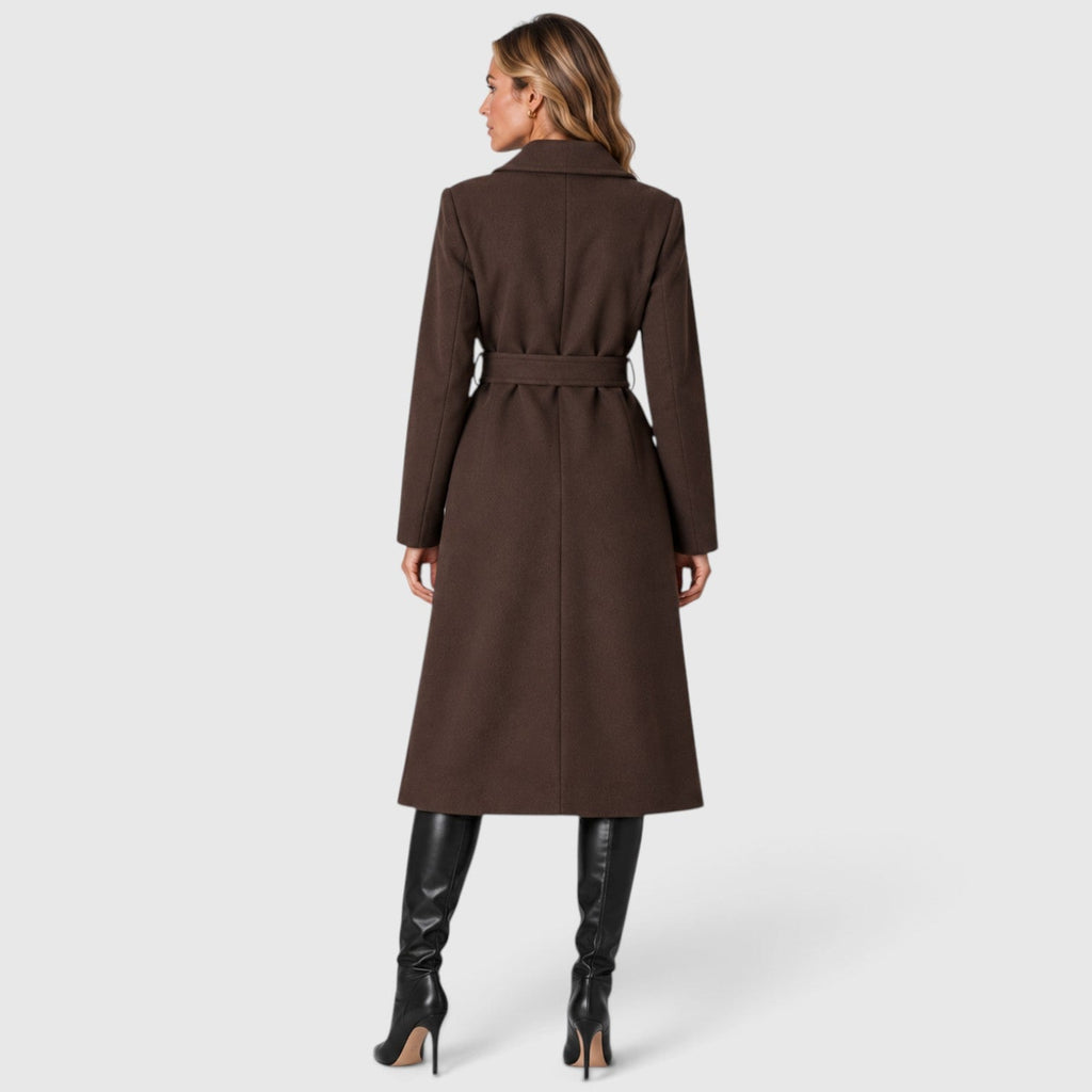 Woman wearing a long double breasted belted coat with wide lapels and knee-high boots - view 6