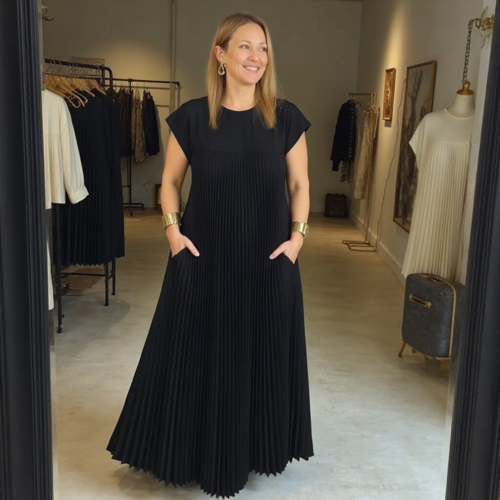 Woman wearing a pleated cap sleeve maxi dress with crew neck - view 12