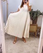 Woman wearing a pleated cap sleeve maxi dress with crew neck - view 17