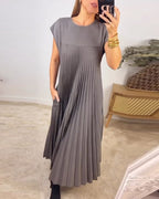 Woman wearing a pleated cap sleeve maxi dress with crew neck - view 6