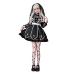 Women's gothic Halloween costume dress in black and white with sheer lace sleeves and embroidered cross panels - view 3