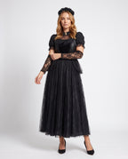 Woman wearing black gothic lace Halloween costume dress with cameo collar, velvet bodice and tulle skirt