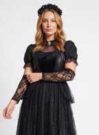 Woman wearing black gothic lace Halloween costume dress with cameo collar, velvet bodice and tulle skirt - view 2
