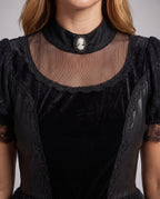 Woman wearing black gothic lace Halloween costume dress with cameo collar, velvet bodice and tulle skirt - view 3