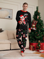 Matching family Christmas pajamas, black top with dabbing Santa graphic and Christmas print jogger pants with red cuffs - view 5