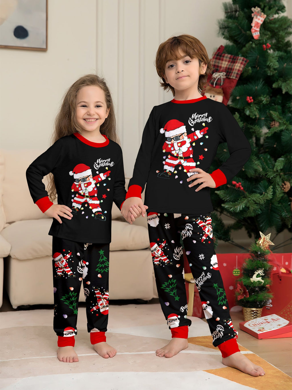 Matching family Christmas pajamas, black top with dabbing Santa graphic and Christmas print jogger pants with red cuffs - view 7