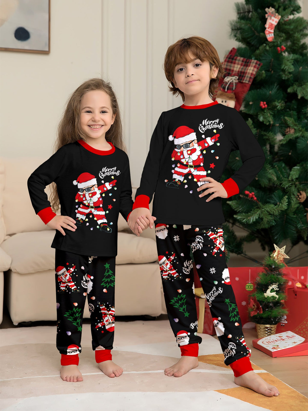 Matching family Christmas pajamas, black top with dabbing Santa graphic and Christmas print jogger pants with red cuffs - view 7