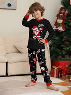 Matching family Christmas pajamas, black top with dabbing Santa graphic and Christmas print jogger pants with red cuffs - view 8