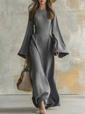 Long sleeve dress with bell cuffs and floor-length skirt in textured fabric