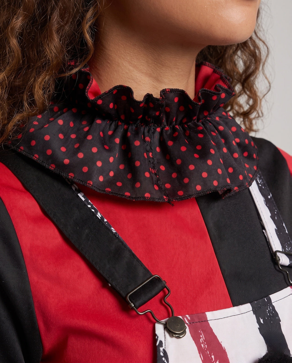 Women's clown Halloween costume with red and black striped pinafore, polka dot ruffle collar and long sleeves - view 2