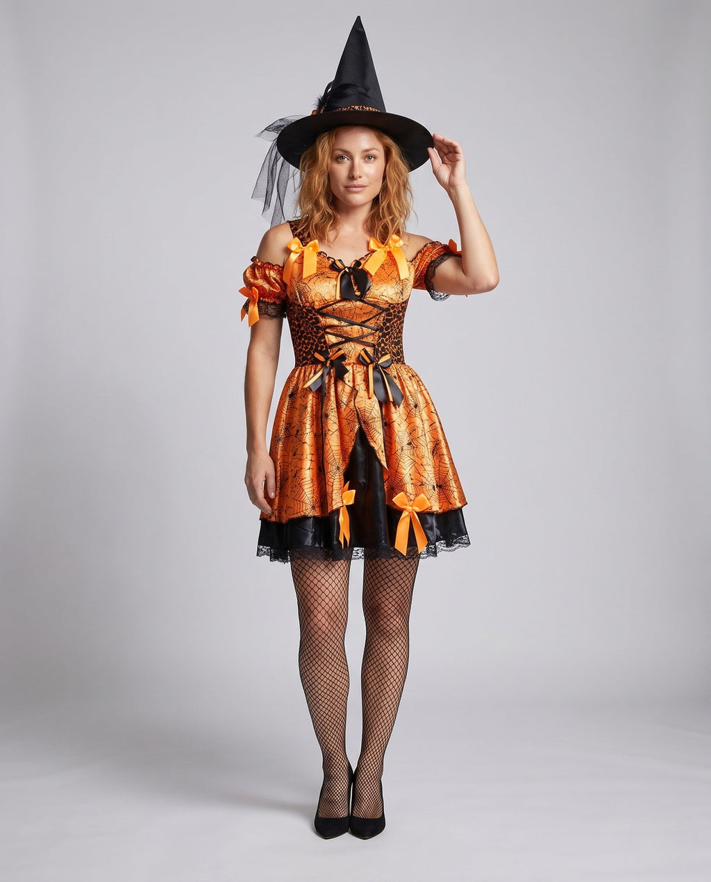 Women's orange spiderweb print witch costume with lace-up corset-style bodice and satin bows