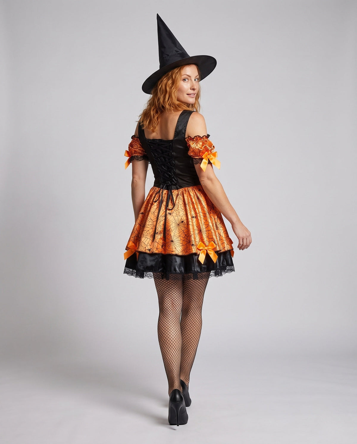 Women's orange spiderweb print witch costume with lace-up corset-style bodice and satin bows - view 3