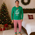 Matching family Christmas pajamas with green elf slogan tops and striped pants - view 3