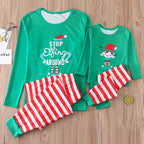 Matching family Christmas pajamas with green elf slogan tops and striped pants - view 7