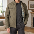 Men's stand collar jacket worn open showing geometric patterned lining