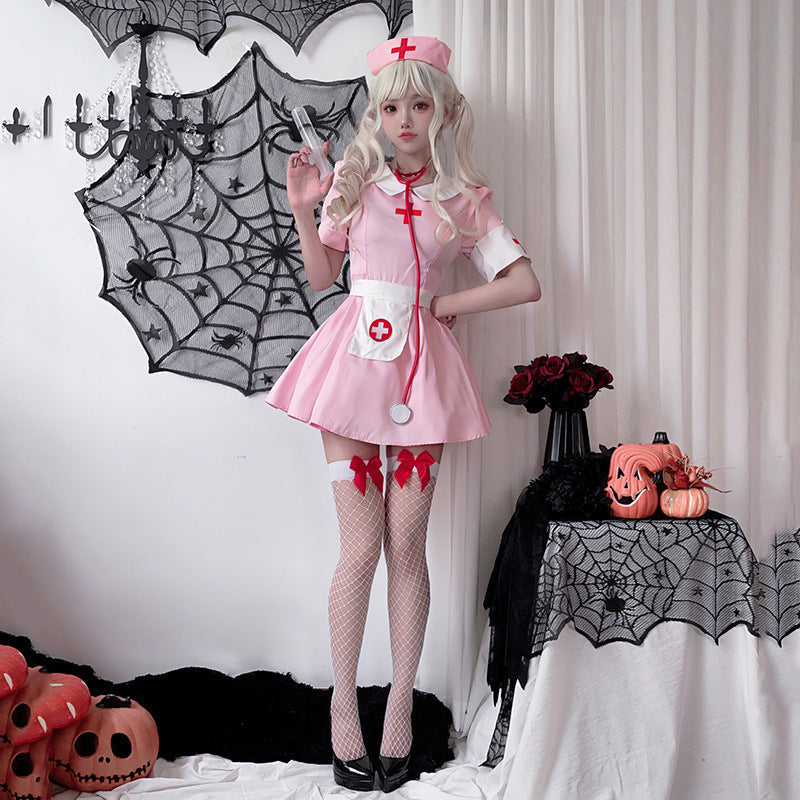 Women's pink nurse Halloween costume with white collar, apron and red cross details - view 4