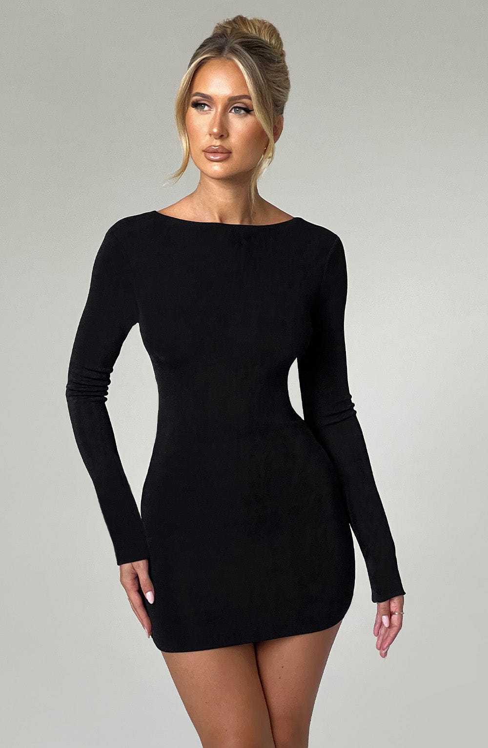 Long sleeve bodycon mini dress with boat neckline and lace-up open back