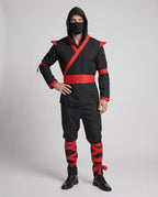 Men's black ninja Halloween costume with hood, red wrap trim, red sash and red leg wraps